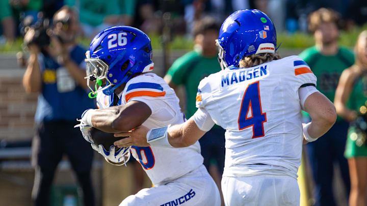 Oct 4, 2025; South Bend, Indiana, USA; Boise State Broncos quarterback Maddux Madsen (4) hands off to running back Sire Gaines (26) against the Notre Dame Fighting Irish during the first half at Notre Dame Stadium. Oct 4, 2025; South Bend, Indiana, USA; Boise State Broncos quarterback Maddux Madsen (4) hands off to running back Sire Gaines (26) against the Notre Dame Fighting Irish during the first half at Notre Dame Stadium.