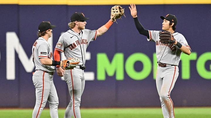 Aug 19, 2026; Cleveland, Ohio, USA; San Francisco Giants left fielder Drew Gilbert (0) and center fielder Jonah Cox (53) and right fielder Jung Hoo Lee (51) celebrate after the Giants beat the Cleveland Guardians at Progressive Field. Mandatory Credit: Ken Blaze-Imagn Images