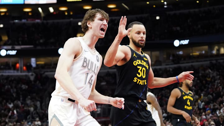 Feb 8, 2025; Chicago, Illinois, USA; Chicago Bulls forward Matas Buzelis (14) reacts after a basket against Golden State Warriors guard Stephen Curry (30) during the second half at United Center. Mandatory Credit: David Banks-Imagn Images