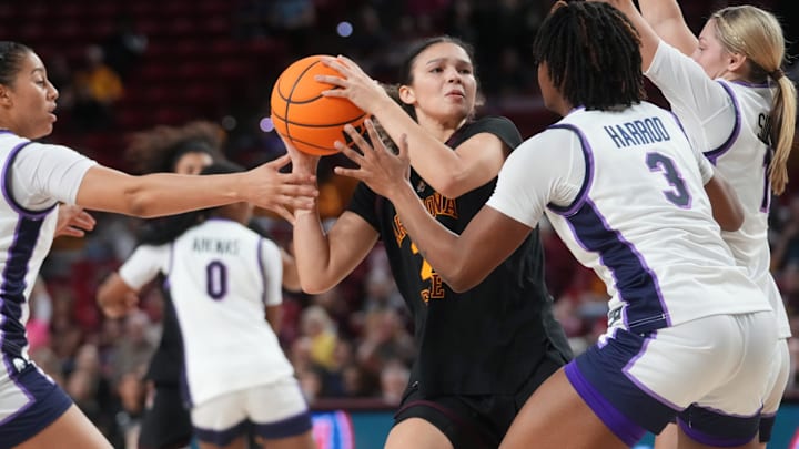 ASU Sun Devils forward McKinna Brackens (21) looks to pass the ball while being defended by Kansas State Wildcats guards Brandie Harrod (3), Taryn Side (11) and forward Jenessa Cotton (24) at Desert Financial Arena in Tempe on Feb. 1, 2026.