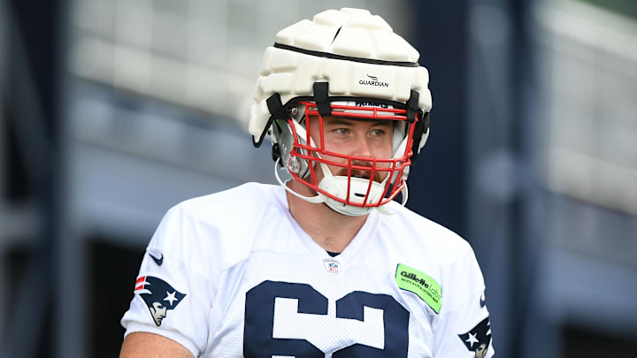 Jul 29, 2022; Foxborough, MA, USA; New England Patriots punter Jake Julien (62) walks onto the field during training camp at Gillette Stadium. Mandatory Credit: Brian Fluharty-Imagn Images