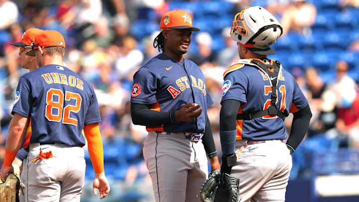 Mar 1, 2026; Port St. Lucie, Florida, USA;  Houston Astros pitcher Alimber Santa (75) talks to catcher Yainer Diaz.