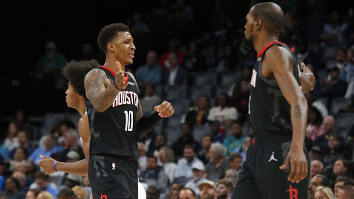 Nov 5, 2025; Memphis, Tennessee, USA; Houston Rockets forward Jabari Smith Jr. (10) reacts with forward Kevin Durant (7)  during the first quarter against the Memphis Grizzlies at FedExForum. Mandatory Credit: Petre Thomas-Imagn Images