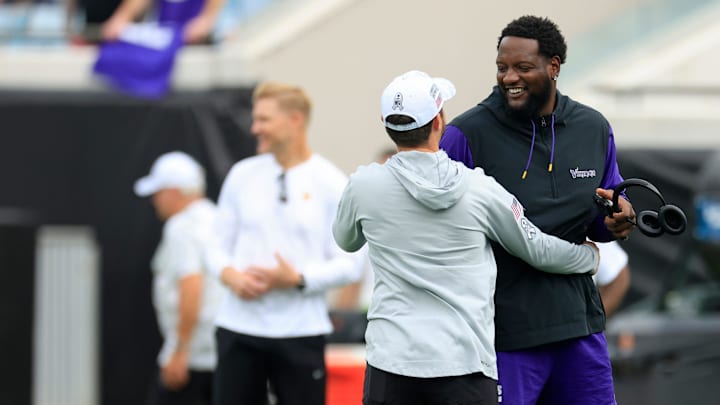 Minnesota Vikings offensive tackle Cam Robinson (74) greets familiar faces before an NFL football matchup Sunday, Nov. 10, 2024 at Everbank Stadium in Jacksonville, Fla.