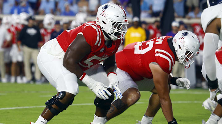 Sep 21, 2024; Oxford, Mississippi, USA; Mississippi Rebels offensive linemen Micah Pettus (57) and Julius Buelow (52) line up before the snap during the first half against the Georgia Southern Eagles at Vaught-Hemingway Stadium. Mandatory Credit: Petre Thomas-Imagn Images