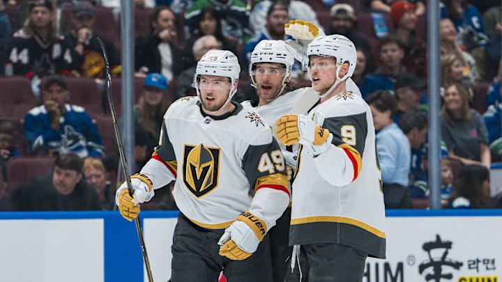 Apr 6, 2025; Vancouver, British Columbia, CAN; Vegas Golden Knights forward Ivan Barbashev (49) and defenseman Noah Hanifin (15) and forward Jack Eichel (9) celebrate Barbashev’s goal against the Vegas Golden Knights in the first period at Rogers Arena. Mandatory Credit: Bob Frid-Imagn Images