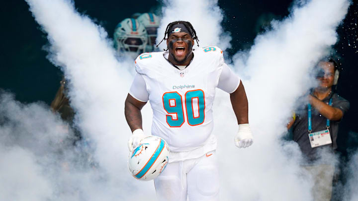 Miami Dolphins defensive tackle Kenneth Grant (90) runs on the field before a game against the Buffalo Bills at Hard Rock Stadium. 