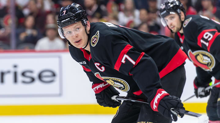 Jan 26, 2025; Ottawa, Ontario, CAN; Ottawa Senators left wing Brady Tkachuk (7) gets in position for a faceoff in the second period against Utah in their game at the Canadian Tire Centre. Mandatory Credit: Marc DesRosiers-Imagn Images