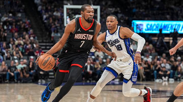 Jan 11, 2026; Sacramento, California, USA; Houston Rockets forward Kevin Durant (7) dribbles against Sacramento Kings guard Russell Westbrook (18) during the fourth quarter at Golden 1 Center. Mandatory Credit: Justine Willard-Imagn Images
