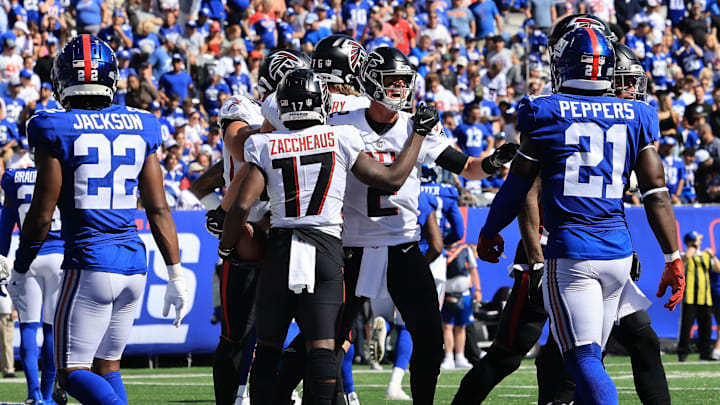 Sep 26, 2021; East Rutherford, New Jersey, USA; Atlanta Falcons wide receiver Olamide Zaccheaus (17) celebrates his touchdown with quarterback Matt Ryan (2) in front of New York Giants cornerback Adoree' Jackson (22) and free safety Jabrill Peppers (21) during the first quarter at MetLife Stadium. Mandatory Credit: Vincent Carchietta-Imagn Images