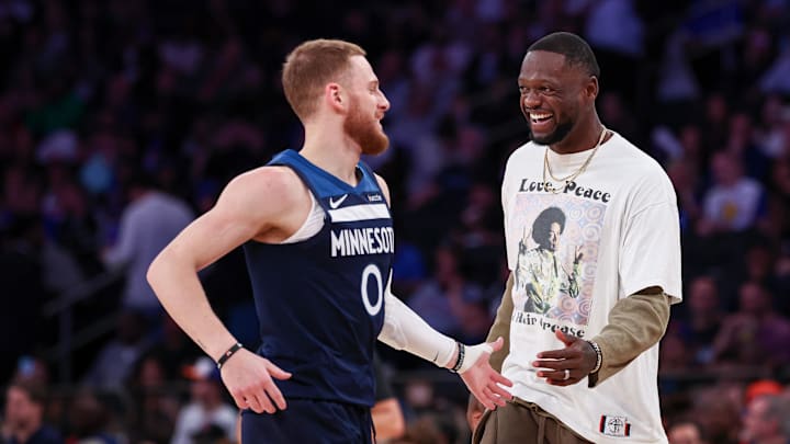 Oct 13, 2024; New York, New York, USA; Minnesota Timberwolves guard Donte DiVincenzo (0) celebrates with forward Julius Randle (30) during the first half against the New York Knicks at Madison Square Garden. Mandatory Credit: Vincent Carchietta-Imagn Images