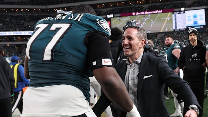Jan 26, 2025; Philadelphia, PA, USA; Philadelphia Eagles general manager Howie Roseman celebrates with Philadelphia Eagles offensive tackle Mekhi Becton (77) during the fourth quarter of the NFC Championship game against the Washington Commanders at Lincoln Financial Field. Mandatory Credit: Bill Streicher-Imagn Images