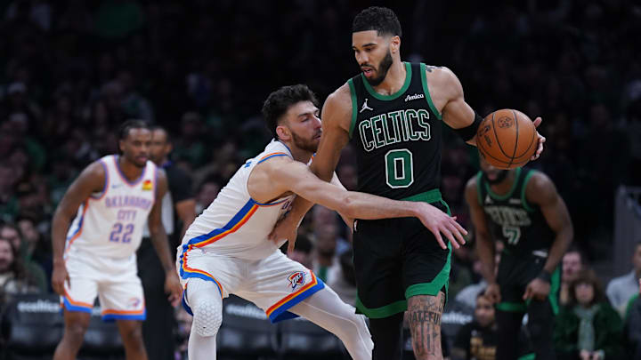 Mar 12, 2025; Boston, Massachusetts, USA; Oklahoma City Thunder forward Chet Holmgren (7) defends against Boston Celtics forward Jayson Tatum (0) in the third quarter at TD Garden. Mandatory Credit: David Butler II-Imagn Images
