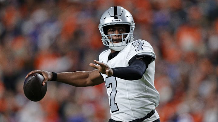 Nov 6, 2025; Denver, Colorado, USA; Las Vegas Raiders quarterback Geno Smith (7) drops back to pass against the Denver Broncos during the first half at Empower Field at Mile High. Mandatory Credit: Isaiah J. Downing-Imagn Images