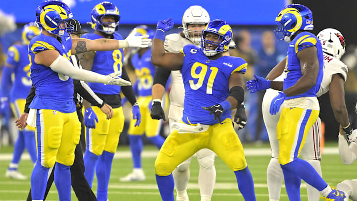 Dec 28, 2024; Inglewood, California, USA; Los Angeles Rams defensive tackle Kobie Turner (91) celebrates after sackiing Arizona Cardinals quarterback Kyler Murray (1) in the second half at SoFi Stadium. Mandatory Credit: Jayne Kamin-Oncea-Imagn Images Dec 28, 2024; Inglewood, California, USA; Los Angeles Rams defensive tackle Kobie Turner (91) celebrates after sackiing Arizona Cardinals quarterback Kyler Murray (1) in the second half at SoFi Stadium. Mandatory Credit: Jayne Kamin-Oncea-Imagn Images