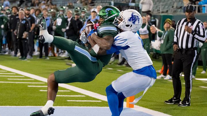 Nov 28, 2024; New Orleans, Louisiana, USA; Tulane Green Wave wide receiver Shazz Preston (6) scores a touchdown against Memphis Tigers defensive back Davion Ross (1) during the fourth quarter at Yulman Stadium. Mandatory Credit: Matthew Hinton-Imagn Images Nov 28, 2024; New Orleans, Louisiana, USA; Tulane Green Wave wide receiver Shazz Preston (6) scores a touchdown against Memphis Tigers defensive back Davion Ross (1) during the fourth quarter at Yulman Stadium. Mandatory Credit: Matthew Hinton-Imagn Images