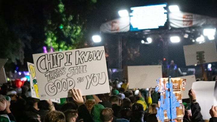 Signs poke fun at former Oregon Ducks head coach Chip Kelly during ESPN’s “College GameDay” Saturday, Oct. 11, 2024 on the campus of the University of Oregon in Eugene, Ore.