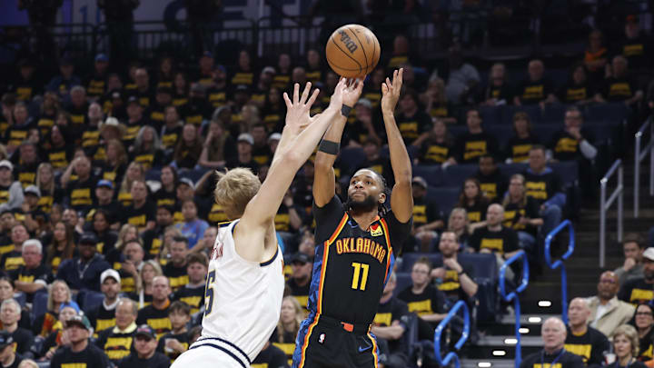 May 7, 2025; Oklahoma City, Oklahoma, USA; Oklahoma City Thunder guard Isaiah Joe (11) shoots a three point basket over Denver Nuggets forward Hunter Tyson (5) in the second half during game two of the second round for the 2025 NBA Playoffs at Paycom Center. Mandatory Credit: Alonzo Adams-Imagn Images