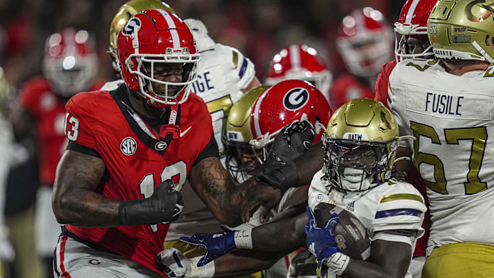 Georgia's Mykel Williams (13) pursues a Georgia Tech running back.