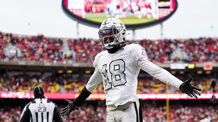 Dec 25, 2023; Kansas City, Missouri, USA; Las Vegas Raiders cornerback Jack Jones (18) interacts with then crowd during the second half against the Kansas City Chiefs at GEHA Field at Arrowhead Stadium. Mandatory Credit: Jay Biggerstaff-Imagn Images