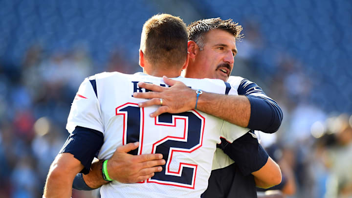 Aug 17, 2019; Nashville, TN, USA; New England Patriots quarterback Tom Brady (12) hugs Tennessee Titans head coach Mike Vrabel before the preseason game at Nissan Stadium. Mandatory Credit: Christopher Hanewinckel-Imagn Images