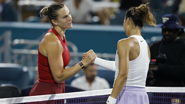 Mar 25, 2025; Miami, FL, USA; Aryna Sabalenka shakes hands with Zheng Qinwen at the net after their match on day eight of the Miami Open at Hard Rock Stadium.