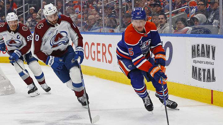 Apr 13, 2026; Edmonton, Alberta, CAN; Edmonton Oilers defensemen Connor Murphy (5) and Colorado Avalanche forward Nicolas Roy (10) chases a loose puck during the second period at Rogers Place. Mandatory Credit: Perry Nelson-Imagn Images Apr 13, 2026; Edmonton, Alberta, CAN; Edmonton Oilers defensemen Connor Murphy (5) and Colorado Avalanche forward Nicolas Roy (10) chases a loose puck during the second period at Rogers Place. Mandatory Credit: Perry Nelson-Imagn Images