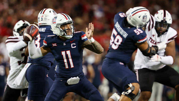 Oct 5, 2024; Tucson, Arizona, USA; Arizona Wildcats quarterback Noah Fifita (11) throws ball during first quarter against Texas Tech Red Raiders at Arizona Stadium. Mandatory Credit: Aryanna Frank-Imagn Images