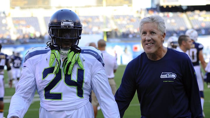 Aug 8, 2013; San Diego, CA, USA; Seattle Seahawks running back Marshawn Lynch (24) and head coach Pete Carroll prior to the game against the San Diego Chargers at Qualcomm Stadium. Mandatory Credit: Christopher Hanewinckel-Imagn Images