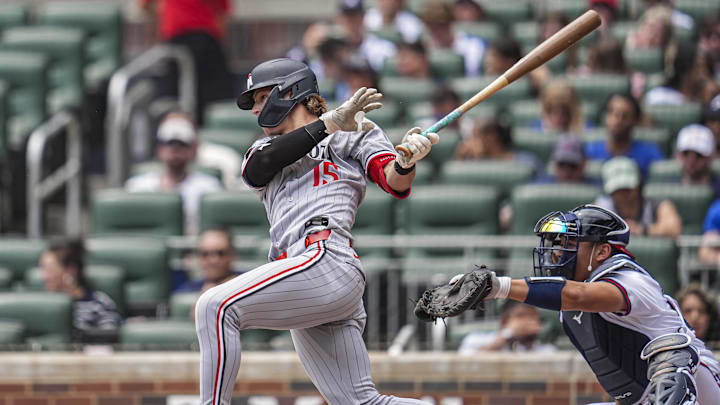 Apr 20, 2025; Cumberland, Georgia, USA; Minnesota Twins designated hitter Luke Keaschall (15) hits a single against the Atlanta Braves during the third inning at Truist Park. Mandatory Credit: Dale Zanine-Imagn Images Apr 20, 2025; Cumberland, Georgia, USA; Minnesota Twins designated hitter Luke Keaschall (15) hits a single against the Atlanta Braves during the third inning at Truist Park. Mandatory Credit: Dale Zanine-Imagn Images