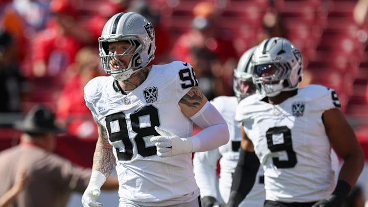 Dec 8, 2024; Tampa, Florida, USA; Las Vegas Raiders defensive end Maxx Crosby (98) takes the field for a game against the Tampa Bay Buccaneers at Raymond James Stadium. Mandatory Credit: Nathan Ray Seebeck-Imagn Images