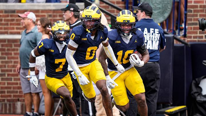 Michigan cornerback Jyaire Hill (0), center, celebrates an interception against Oklahoma with cornerback Zeke Berry (10), and safety Chris Bracy (7) during the second half at Michigan Stadium in Ann Arbor on Saturday, Sept. 12, 2026.
