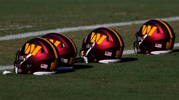 Jun 15, 2022; Ashburn, Virginia, USA; Washington Commanders players' helmets rest on the field on day two of minicamp at The Park. Mandatory Credit: Geoff Burke-USA TODAY Sports