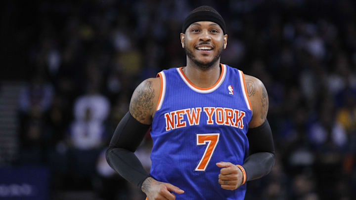Mar 30, 2014; Oakland, CA, USA; New York Knicks forward Carmelo Anthony (7) smiles on the court against the Golden State Warriors in the first quarter at Oracle Arena. Mandatory Credit: Cary Edmondson-Imagn Images