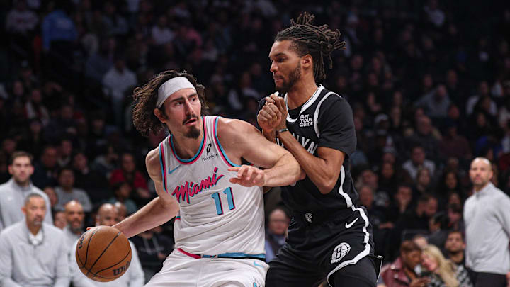 Feb 7, 2025; Brooklyn, New York, USA; Miami Heat guard Jaime Jaquez Jr. (11) is guarded by Brooklyn Nets forward Ziaire Williams (8) during the second half at Barclays Center. Mandatory Credit: Vincent Carchietta-Imagn Images