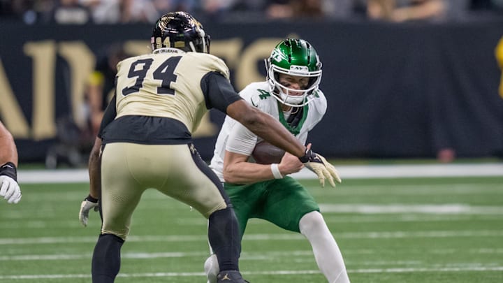 Dec 21, 2025; New Orleans, Louisiana, USA; New Orleans Saints defensive end Cameron Jordan (94) sacks New York Jets quarterback Brady Cook (4) during the first half at Caesars Superdome. Mandatory Credit: Matthew Hinton-Imagn Images