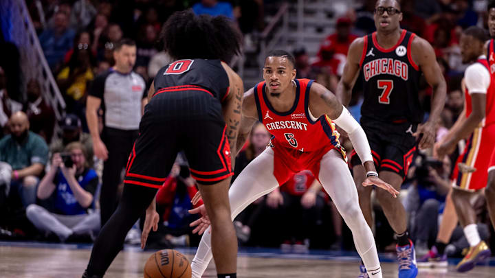 Oct 23, 2024; New Orleans, Louisiana, USA;  New Orleans Pelicans guard Dejounte Murray (5) guards Chicago Bulls guard Coby White (0) during the second half at Smoothie King Center. 