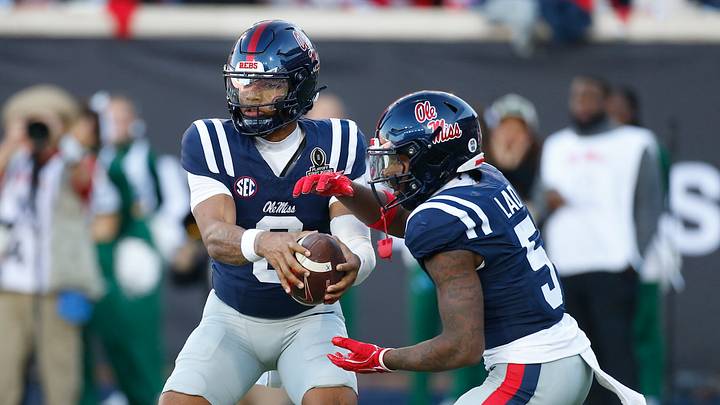 Mississippi Rebels quarterback Trinidad Chambliss (6) fakes the handoff to running back Kewan Lacy. Credit: Petre Thomas-Imagn Images
