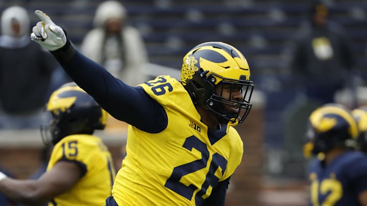 Apr 1, 2023; Ann Arbor, MI, USA; Michigan Wolverines defensive lineman Rayshaun Benny (26) celebrates during the Spring Game at Michigan Stadium. Mandatory Credit: Rick Osentoski-Imagn Images