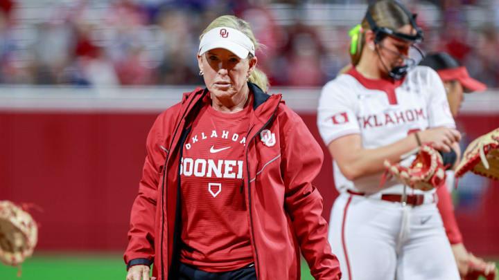 Oklahoma coach Patty Gasso walks back to the dugout after a visit to the circle.