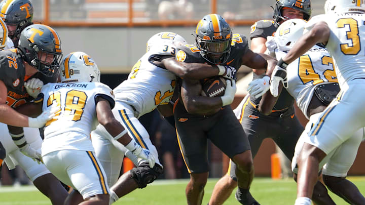 Chattanooga defensive edge Jestin Gilmore (33) tackles Tennessee running back Khalifa Keith (20) during a football game between Tennessee and Chattanooga at Neyland Stadium in Knoxville, Tenn., on Saturday, August 31, 2024. Chattanooga defensive edge Jestin Gilmore (33) tackles Tennessee running back Khalifa Keith (20) during a football game between Tennessee and Chattanooga at Neyland Stadium in Knoxville, Tenn., on Saturday, August 31, 2024.