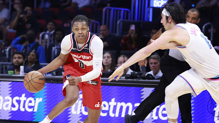 Apr 13, 2025; Miami, Florida, USA;  Miami Heat guard Jaime Jaquez Jr. (11) defends Washington Wizards guard Bub Carrington (8) during the second half at Kaseya Center. Mandatory Credit: Rhona Wise-Imagn Images