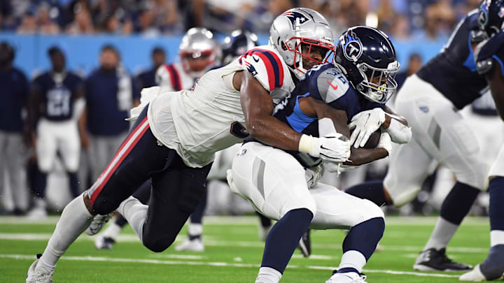 Aug 25, 2023; Nashville, Tennessee, USA; Tennessee Titans running back Julius Chestnut (36) is tackled for a loss by New England Patriots linebacker Ronnie Perkins (51) during the first half at Nissan Stadium. Mandatory Credit: Christopher Hanewinckel-Imagn Images
