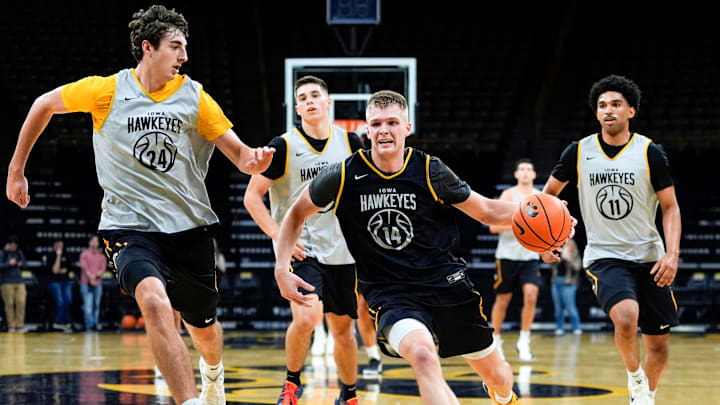Iowa’s Bennett Stirtz (14) drives to the basket as Tate Sage (24) defends during practice Oct. 15, 2025 at Carver-Hawkeye Arena in Iowa City, Iowa. Iowa’s Bennett Stirtz (14) drives to the basket as Tate Sage (24) defends during practice Oct. 15, 2025 at Carver-Hawkeye Arena in Iowa City, Iowa.