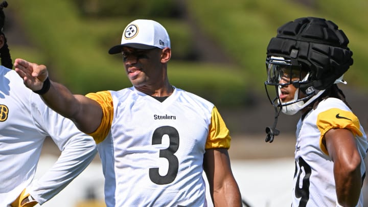Jul 28, 2024; Latrobe, PA, USA; Pittsburgh Steelers quarterback Russell Wilson (3) talks to wide receiver Calvin Austin III (19) during training camp at Saint Vincent College. Mandatory Credit: Barry Reeger-USA TODAY Sports