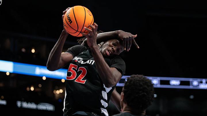 Mar 11, 2026; Kansas City, MO, USA; Cincinnati Bearcats center Moustapha Thiam (52) rebounds during the first half against the UCF Knights at T-Mobile Center. Mandatory Credit: William Purnell-Imagn Images
