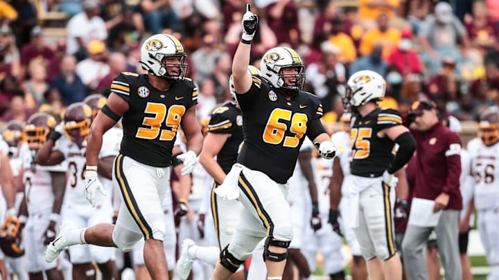 Sept. 9, 2024; Columbia, Missouri, USA: Missouri Tigers senior center Drake Heismeyer (69) runs onto Faurot Field with senior defensive lineman Chris Turner (39) while beating the Central Michigan Chippewas. Sept. 9, 2024; Columbia, Missouri, USA: Missouri Tigers senior center Drake Heismeyer (69) runs onto Faurot Field with senior defensive lineman Chris Turner (39) while beating the Central Michigan Chippewas.