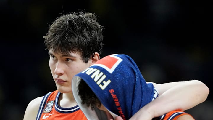 Illinois Fighting Illini forward David Mirkovic (0) and Fighting Illini guard Keaton Wagler (23) walk off the court Saturday, April 4, 2026, following the UConn Huskies' 71-62 Final Four victory at Lucas Oil Stadium in Indianapolis.