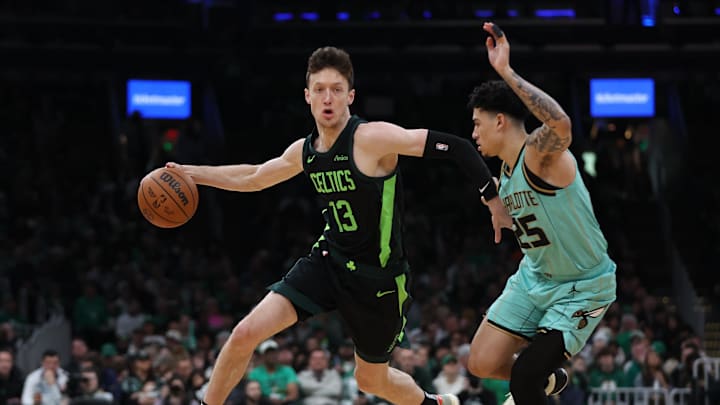 Apr 13, 2025; Boston, Massachusetts, USA; Boston Celtics forward Drew Peterson (13) dribbles down the court during the first half against the Charlotte Hornets at TD Garden. Mandatory Credit: Paul Rutherford-Imagn Images