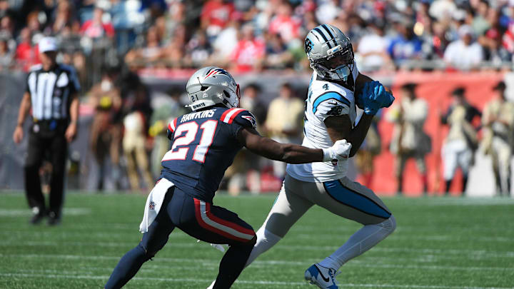 Sep 28, 2025; Foxborough, Massachusetts, USA; Carolina Panthers wide receiver Tetairoa McMillan (4) runs with the ball wile New England Patriots safety Jaylinn Hawkins (21) defends during the first half at Gillette Stadium. Mandatory Credit: Bob DeChiara-Imagn Images Sep 28, 2025; Foxborough, Massachusetts, USA; Carolina Panthers wide receiver Tetairoa McMillan (4) runs with the ball wile New England Patriots safety Jaylinn Hawkins (21) defends during the first half at Gillette Stadium. Mandatory Credit: Bob DeChiara-Imagn Images